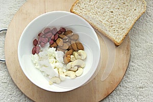 Healthy meals with nuts, bread and cÂottage cheese